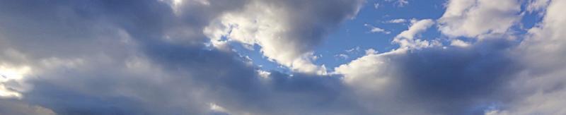 Image of a partly cloudy and partly clear sky during the day photo