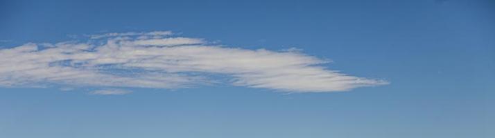 Image of a partly cloudy and partly clear sky during the day photo