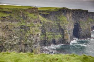 View over cliff line of the Cliffs of Moher in Ireland during daytime photo