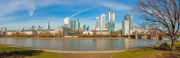 Panoramic picture from Main river bank over Frankfurt skyline with blue sky and sunshine photo