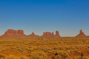 Panoramic pictures of rock formations in the evening sun in the Monument Valley National Park in winter photo