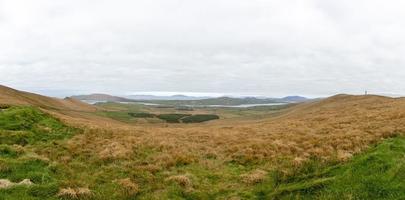 Panorama picture of typical Iriish landscape during daytime photo