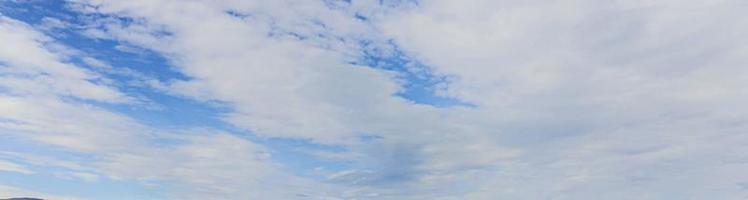 Image of a partly cloudy and partly clear sky during the day photo