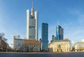 View over the square at Rossmarkt in Frankfurt with skyline in the background during sunrise photo