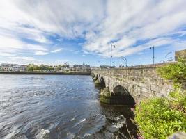 Thomond bridge in Limerick with river Shannon during daytime in summer photo