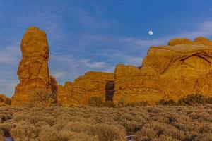 Panoramic picture of impressive sandstone formations in Arches National Park at night in winter photo