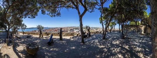 Panoramic picture of garden inside Castelo de Sao Jorge with view on Lisbon in summer photo