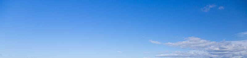 Image of a partly cloudy and partly clear sky during the day photo