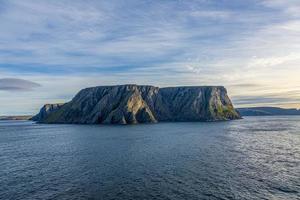 View to cliffs of north cape from sea view in summer photo