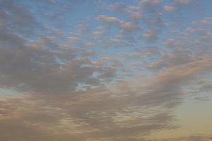 Dramatic colorful sky with afterglow and illuminated clouds photo