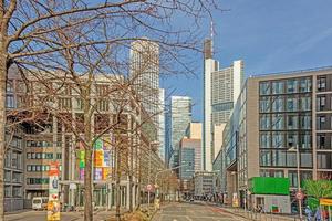 View from the street Untermainkai in Frankfurt over Neue Mainzer Strasse to the skyline in morning light photo