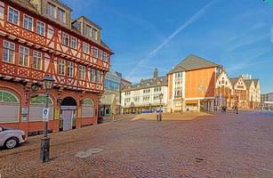 Panoramic view over historic Frankfurt Roemer square with city hall, cobblestone streets and old half-timbered houses in morning light photo