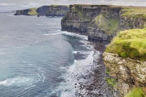 View over cliff line of the Cliffs of Moher in Ireland during daytime photo