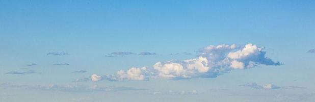 Image of a partly cloudy and partly clear sky during the day photo