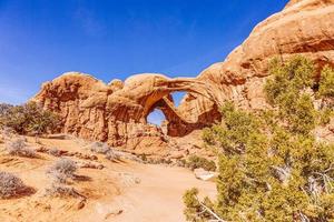 Panoramic picture of natural and geological wonders of Arches national park in Utah in winter photo