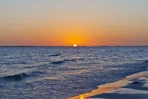 Sunset over sea with deserted beach in Florida photo
