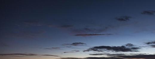 Dramatic colorful sky with afterglow and illuminated clouds photo