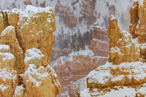 Snow-covered rock pins in Bryce Canyon photo