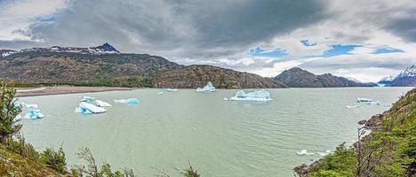 Panoramic image over Lago Grey with icebergs in Torres del Paine National Park in Patagonia in summer photo