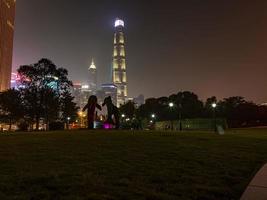View from Gucheng park towards Pudong skyline in Shanghai at night in summer photo
