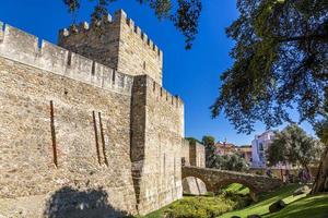 Surrounding wall of Castelo de Sao Jorge in Lisbon in summer during daytime photo