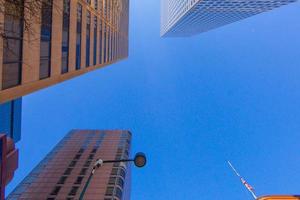 Vertical view of highrise buildings during daytime in the Denver financial district photo