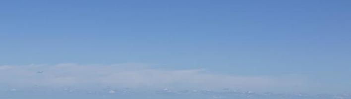 Image of a partly cloudy and partly clear sky during the day photo