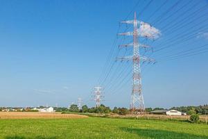 Image of large high voltage power line with warning colors with high power poles for power supply photo