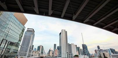 Horizontal banner of large city buildings with sky. photo