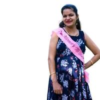 Indian couple posing for maternity baby shoot with white plain background. The couple is posing in a lawn with green grass and the woman is falunting her baby bump in Lodhi Garden in New Delhi, India photo