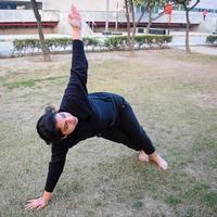 Young Indian woman practicing yoga outdoor in a park. Beautiful girl practice basic yoga pose. Calmness and relax, female happiness. Basic Yoga poses outdoor photo