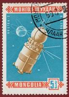 MONGOLIA - CIRCA 1963 Postage stamp printed in Mongolia shows Soviet spaceship Vostok 2, the series Spaceship USSR. April 12 the day of cosmonautics photo