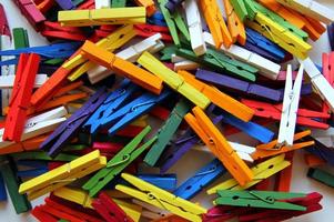 Multicolored clothespins. The colorful background. photo