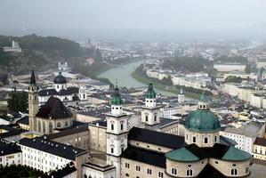 Travel to Salzburg, Austria. The view on the city and the embankment of the river in the rainy day. photo