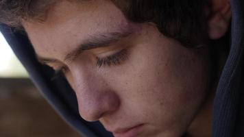 Close up Of Teenage Boy, Face, Eyes looking down video