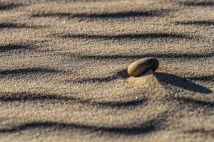 Patterns in the Sea Sand at Sunset photo