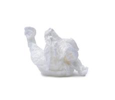 Single white screwed or crumpled tissue paper or napkin in strange shape after use in toilet or restroom isolated on white background with clipping path photo