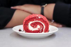 High Angle View Of Red velvet swiss roll Served In Plate On Table photo