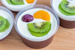 Fruity milk pudding, sweet chocolate silk pudding dessert with fruit topping photo