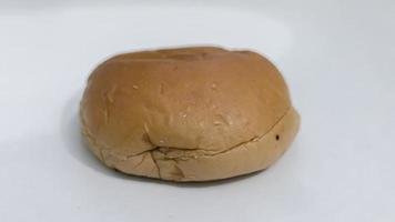 a chocolate donut against a white background photo