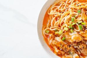 ramen noodles with gyoza or pork dumplings photo