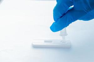 Scientist making a antigen rapid test kit for viral disease COVID-19 nCoV Laboratory card kit test for coronavirus. photo