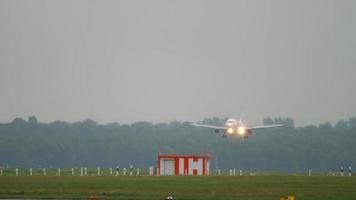 DUSSELDORF, GERMANY JULY 24, 2017 - Airbus A320 of AirBerlin Etihad landing on the runway after rain video
