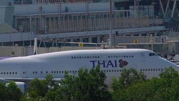 PHUKET, THAILAND NOVEMBER 29, 2019 - Thai Airways Boeing 747 HS TGG taxiing after landing at Phuket International airport HKT. Jumbo jet arrival at the airport video