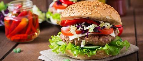 Sandwich hamburger with juicy burgers, cheese and mix of cabbage photo