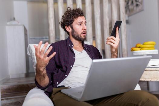 Business man at home on mobile yelling and screaming about bad report and failure with project, mad boss angry about software bugs in application for work photo