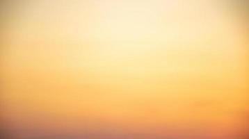 Blurred abstract sky orange gradient background design template photo