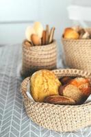 Assortment of bread - gluten-free, corn, rye bread in jute craft basket. Home bakery, home cooking photo