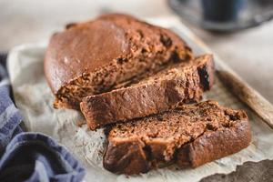 Banana bread sliced with coffee. Vegan pasrty. Home bakery concept. Close-up photo