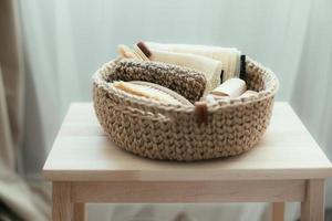 Natural product in jude basket. Bodybrush, toothbrush, shopping bag, soap. Treat yourself concept photo